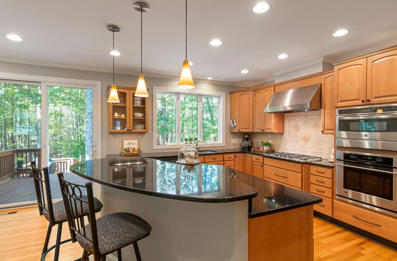 Cleaner wiping kitchen counters during recurring standard cleaning in occupied Chino Hills home